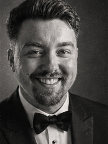 Dean Watson smiling in black tie